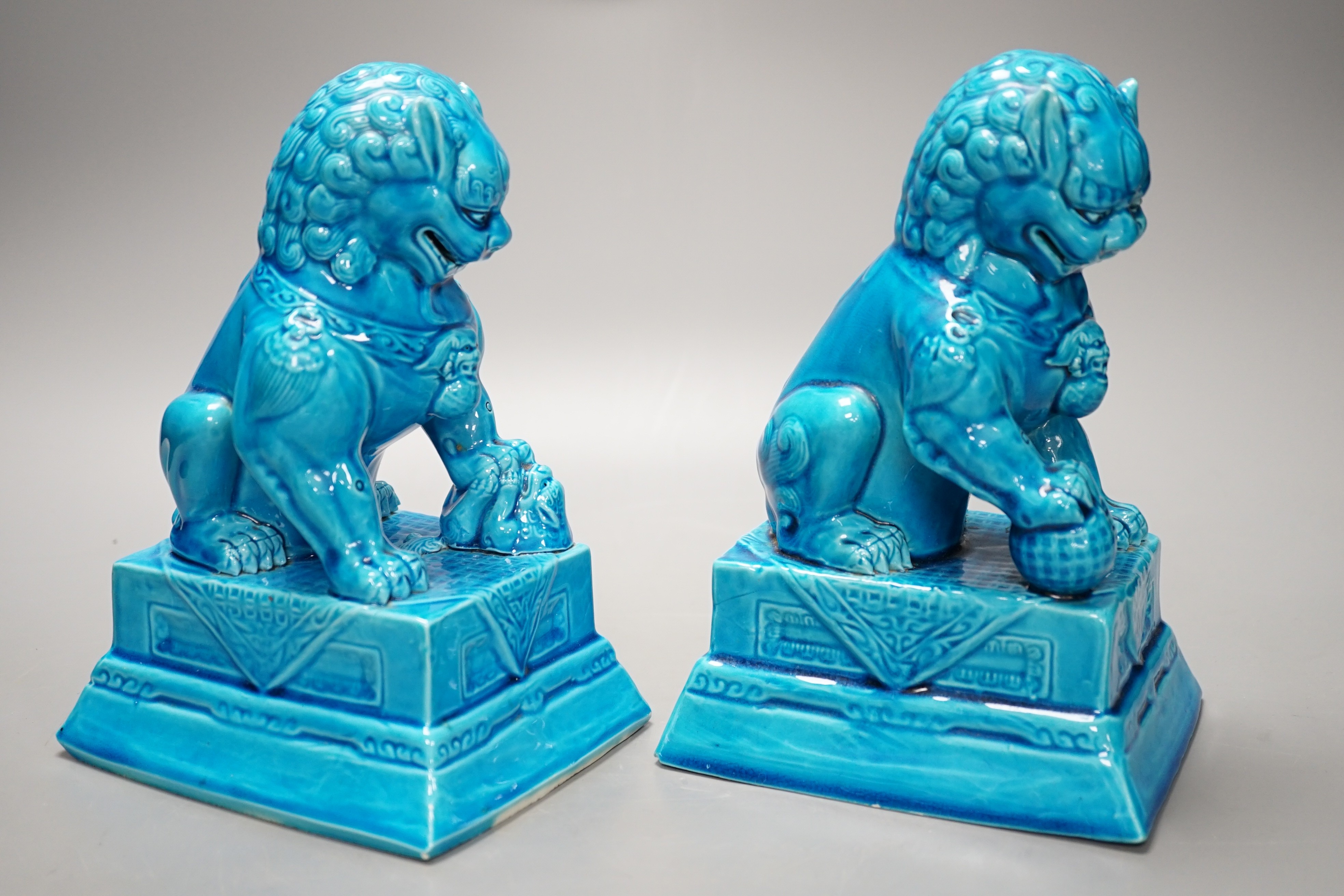 A pair of Chinese turquoise glazed temple lions 21cm